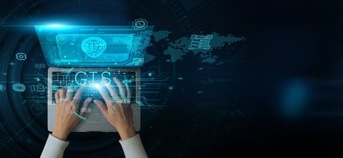 A man using GIS technology to analyze spatial data mapping